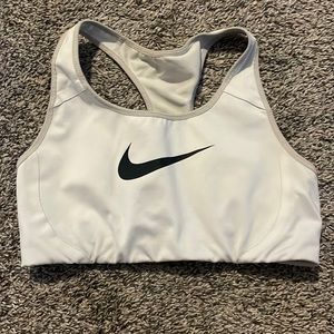 Used white Nike sports bra with black swoosh used condition with discolouring